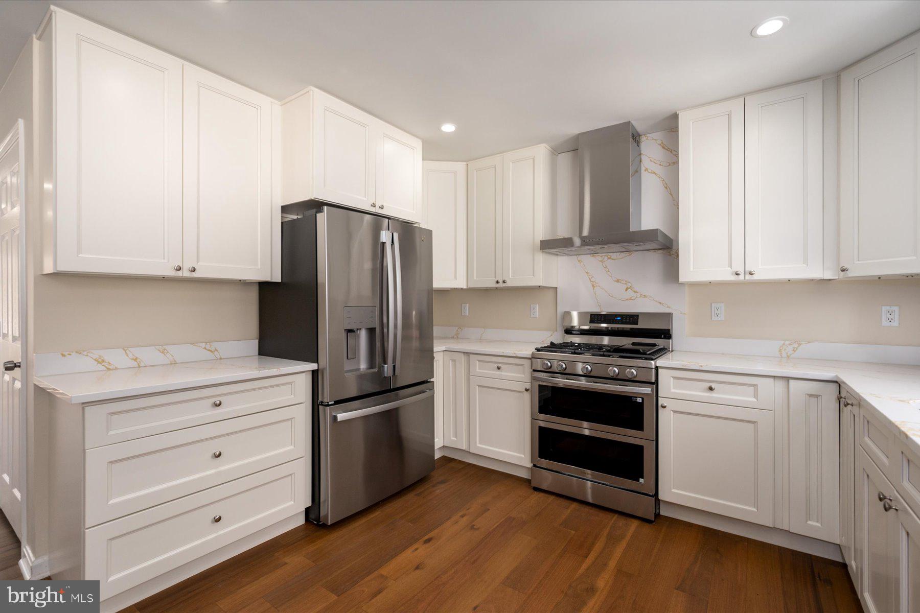 2942 Southaven Drive Annapolis, MD 21401 - Photo 11 of 41 a kitchen with granite countertop white cabinets and stainless steel appliances