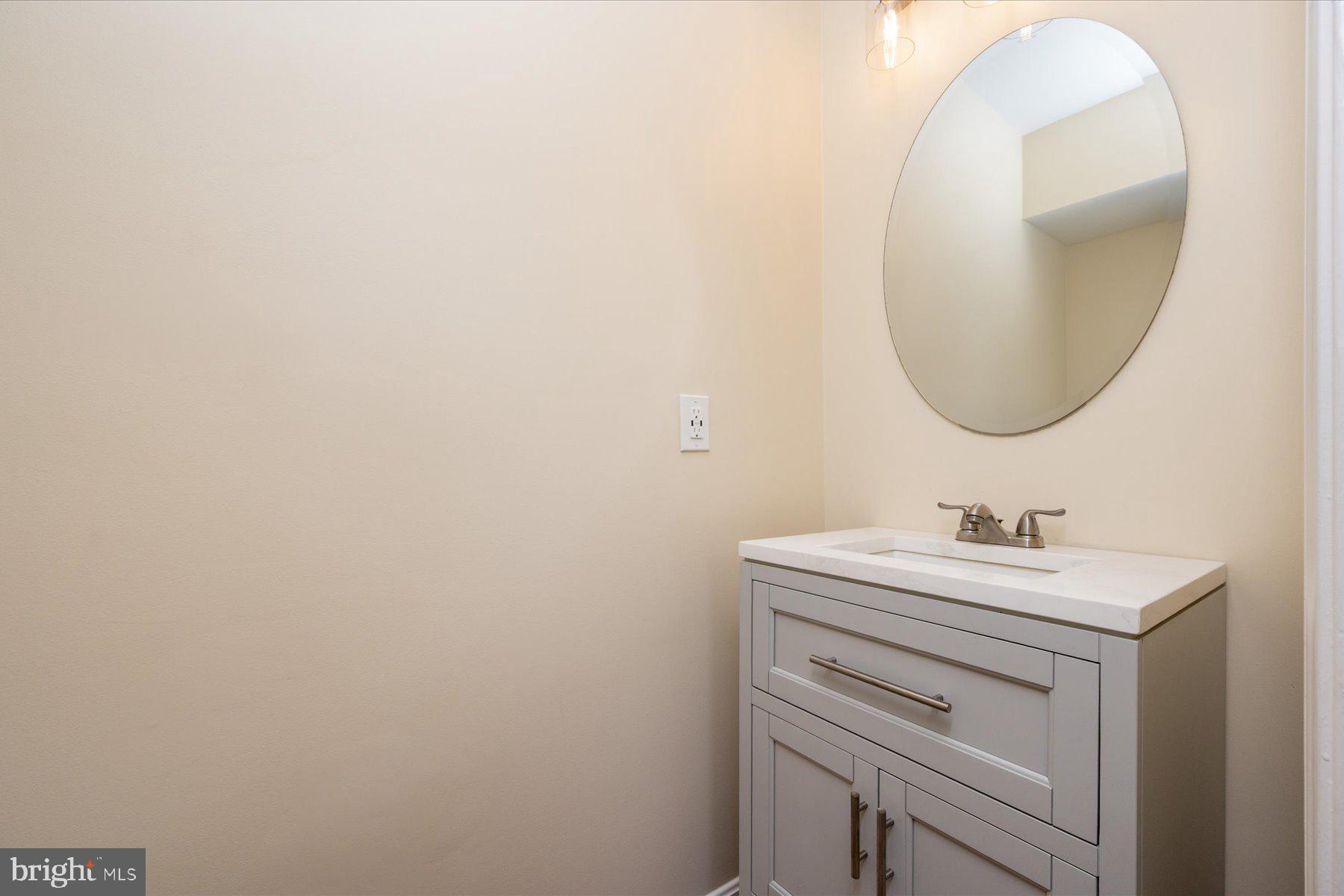 2942 Southaven Drive Annapolis, MD 21401 - Photo 14 of 41 a bathroom with a sink and a mirror