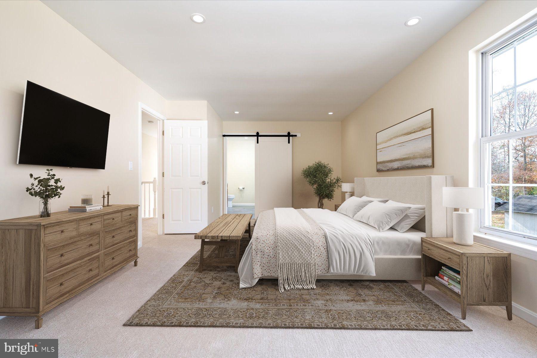 2942 Southaven Drive Annapolis, MD 21401 - Photo 15 of 41 a spacious bedroom with a large bed and a flat screen tv