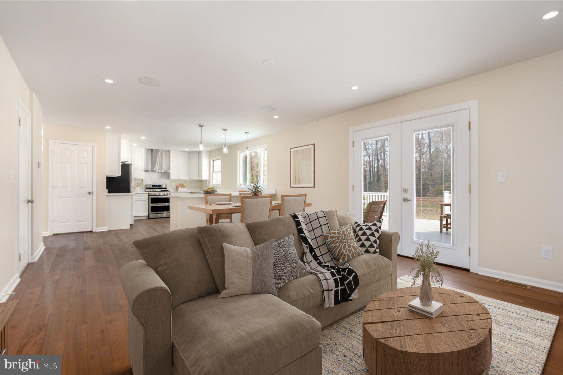 2942 Southaven Drive Annapolis, MD 21401 - Photo 4 of 41 a living room with furniture and a chandelier