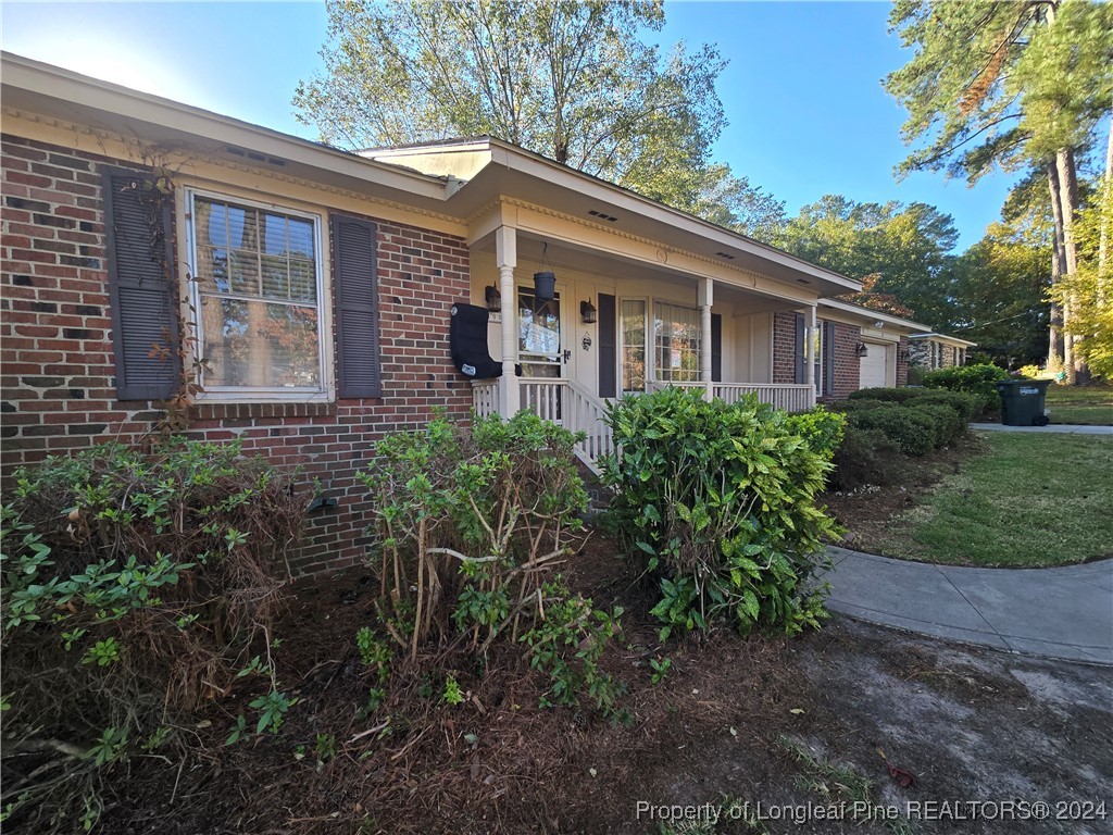 6400 Milford Road Fayetteville, NC 28303 - Photo 1 of 23 a front view of a house with garden