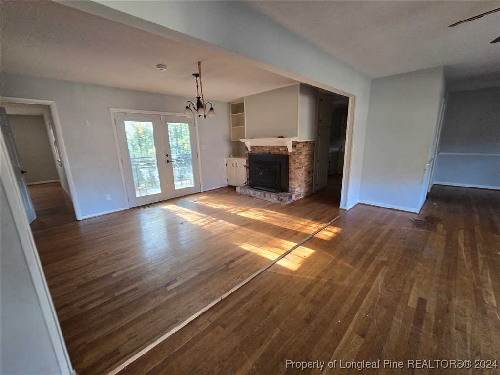 6400 Milford Road Fayetteville, NC 28303 - Photo 11 of 23 a view of a kitchen with a sink and dishwasher wooden floor
