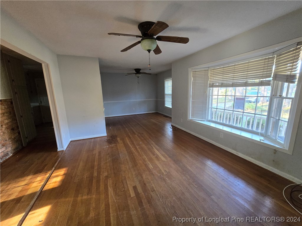 6400 Milford Road Fayetteville, NC 28303 - Photo 12 of 23 a view of empty room with wooden floor and fan