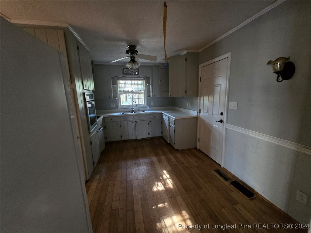 6400 Milford Road Fayetteville, NC 28303 - Photo 14 of 23 a kitchen with cabinets and window