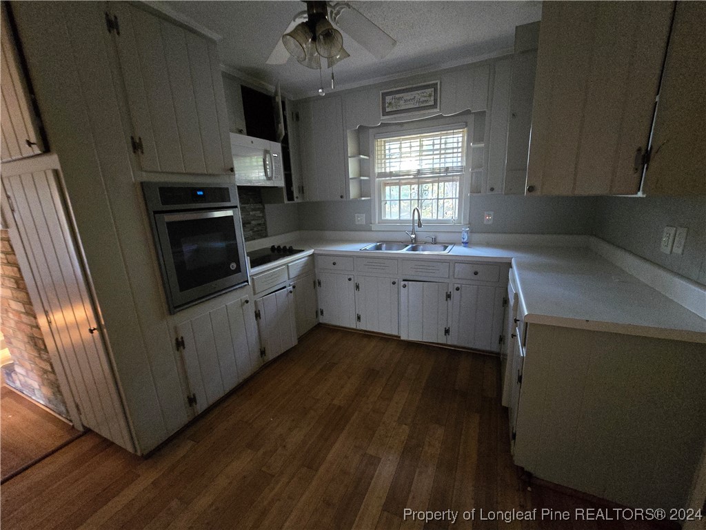 6400 Milford Road Fayetteville, NC 28303 - Photo 15 of 23 a kitchen with sink cabinets and window
