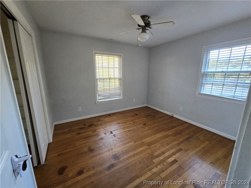 6400 Milford Road Fayetteville, NC 28303 - Photo 20 of 23 a view of empty room with wooden floor and fan