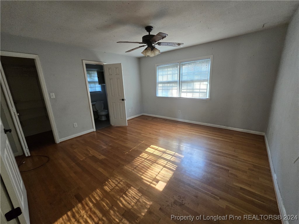 6400 Milford Road Fayetteville, NC 28303 - Photo 21 of 23 wooden floor in an empty room with a window