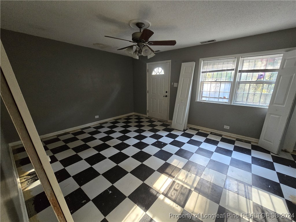 6400 Milford Road Fayetteville, NC 28303 - Photo 22 of 23 a view of a room with a black and white checkered floor