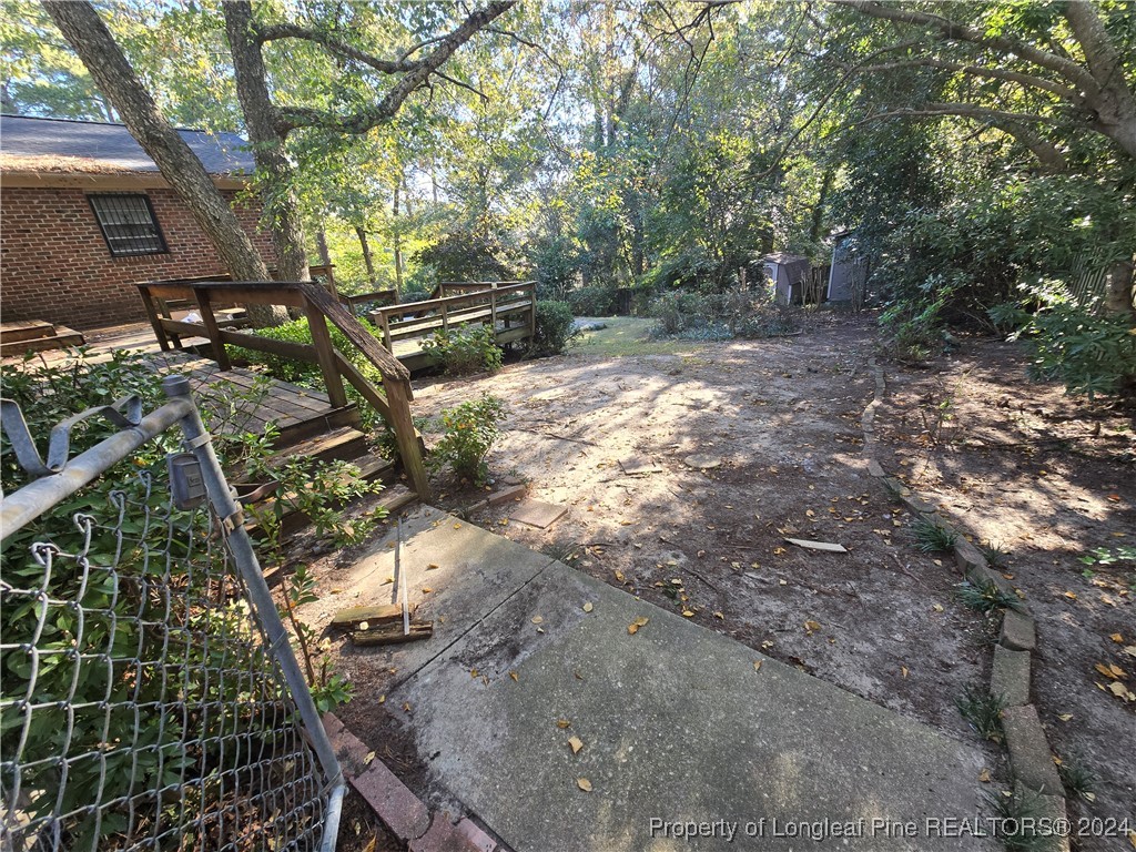 6400 Milford Road Fayetteville, NC 28303 - Photo 5 of 23 a view of outdoor space with deck and tree