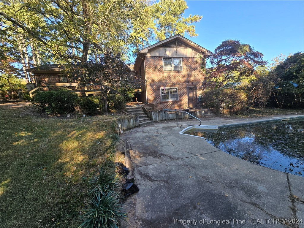 6400 Milford Road Fayetteville, NC 28303 - Photo 9 of 23 a view of a house with a yard