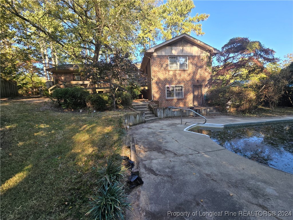 6400 Milford Road Fayetteville, NC 28303 - Photo 10 of 23 a view of a house with a yard