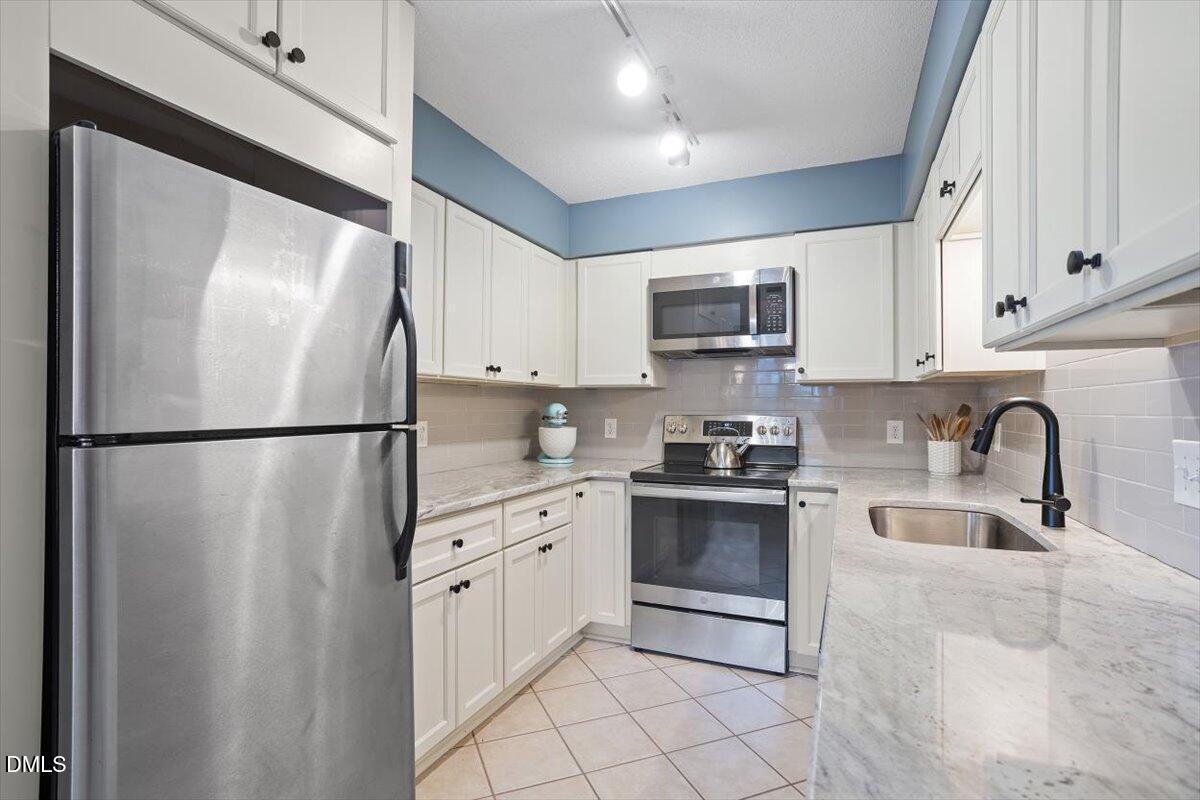 1008 Oak Lake Court Raleigh, NC 27606 - Photo 2 of 34 Kitchen (renovated in 2025!)