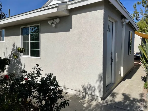 a view of a house with a flower garden
