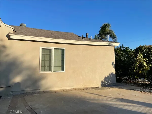 a view of a house with a street
