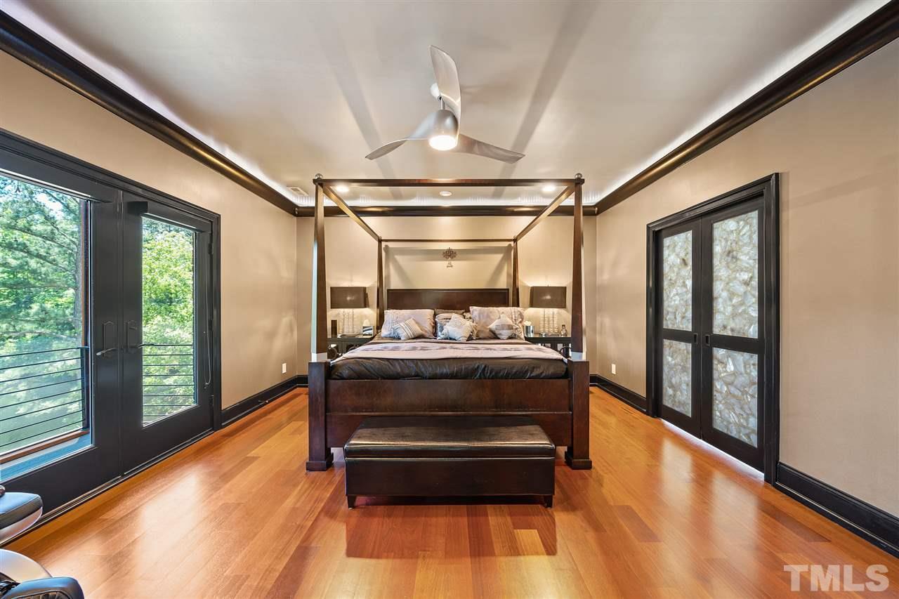 1209 Graedon Drive Raleigh, NC 27603 - Photo 14 of 30 Juliette balcony views to the downstairs. Private screened porch. LED accent lighting.