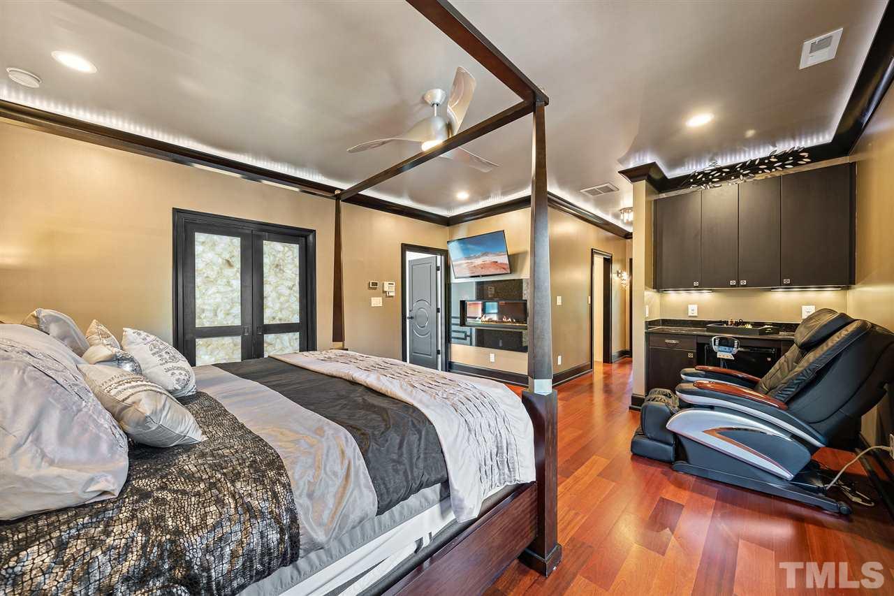 1209 Graedon Drive Raleigh, NC 27603 - Photo 15 of 30 Private butler pantry with custom cabinets and Galaxy Granite. Gas fireplace with remote control.