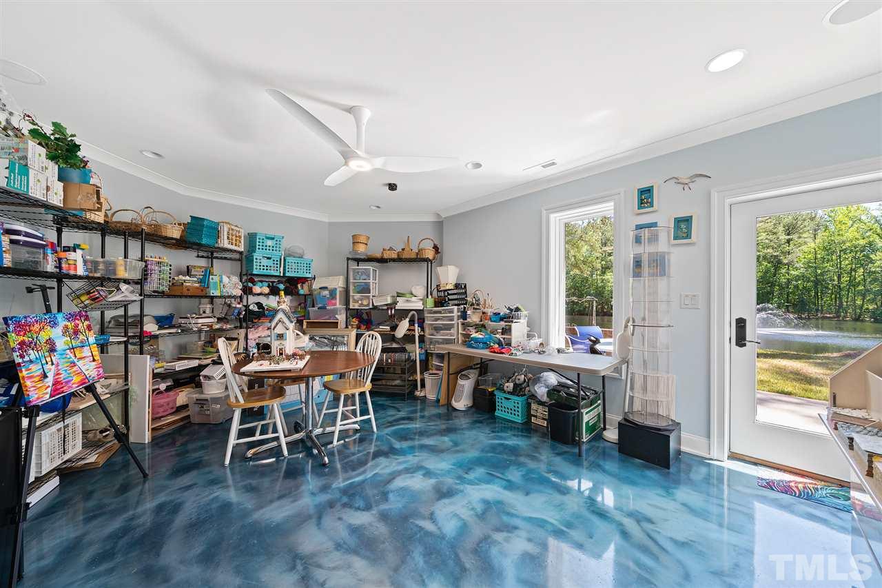 1209 Graedon Drive Raleigh, NC 27603 - Photo 28 of 30 Deep sinks with granite counters & custom cabinetry. Walk out to paint on the outside patio. Electrical and venting already prepared for a kiln. Special exhaust venting fan exists for paint fumes.