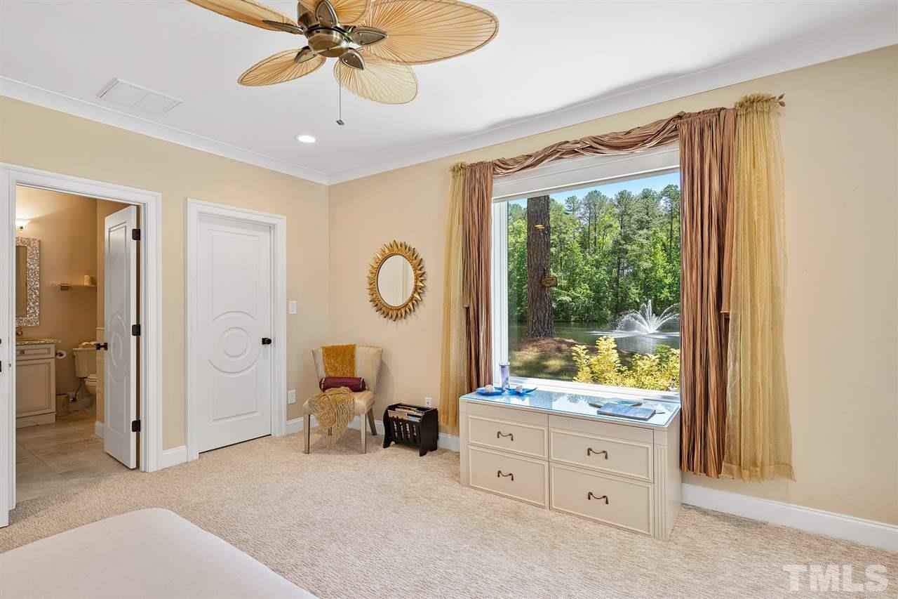 1209 Graedon Drive Raleigh, NC 27603 - Photo 30 of 30 French doors to pool area. Calming fountain view. Solar shades.Bathroom has imported, handmade Mother of Pearl accents in shower, mirror and sink.