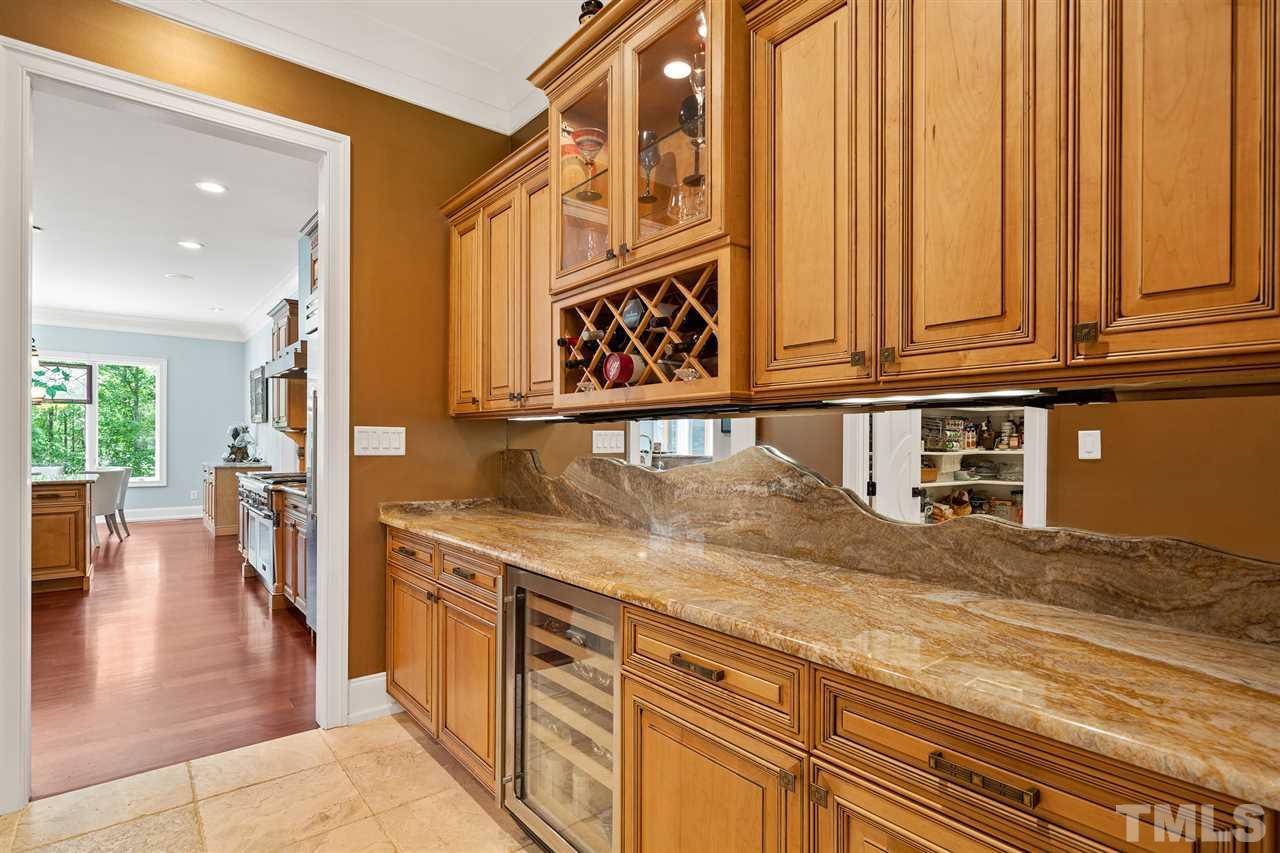 1209 Graedon Drive Raleigh, NC 27603 - Photo 8 of 30 Handcarved stone & glass mirror mural. Opens to the ample pantry (8.4x8.4)