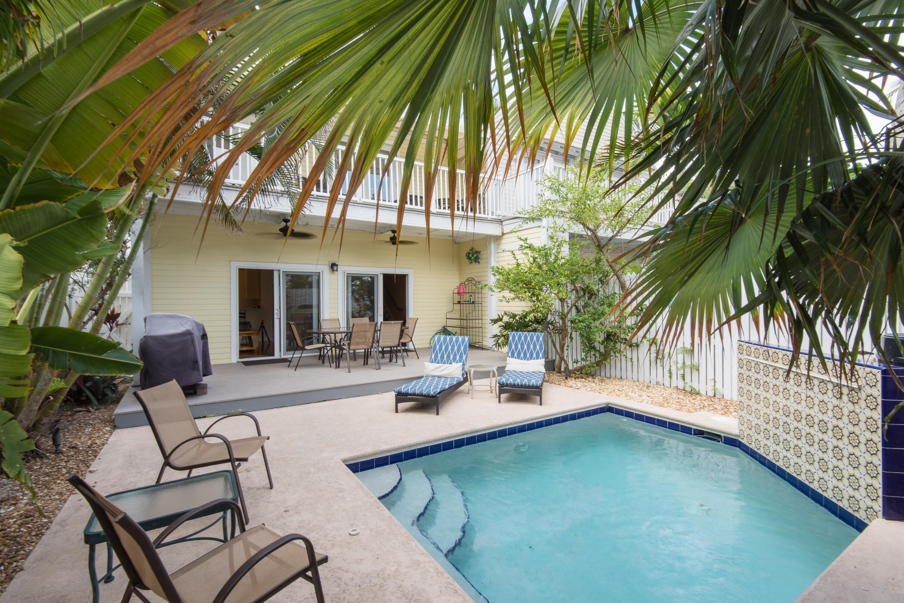 502 Porter Lane Key West, FL 33040 - Photo 19 of 38 a view of a backyard patio and swimming pool