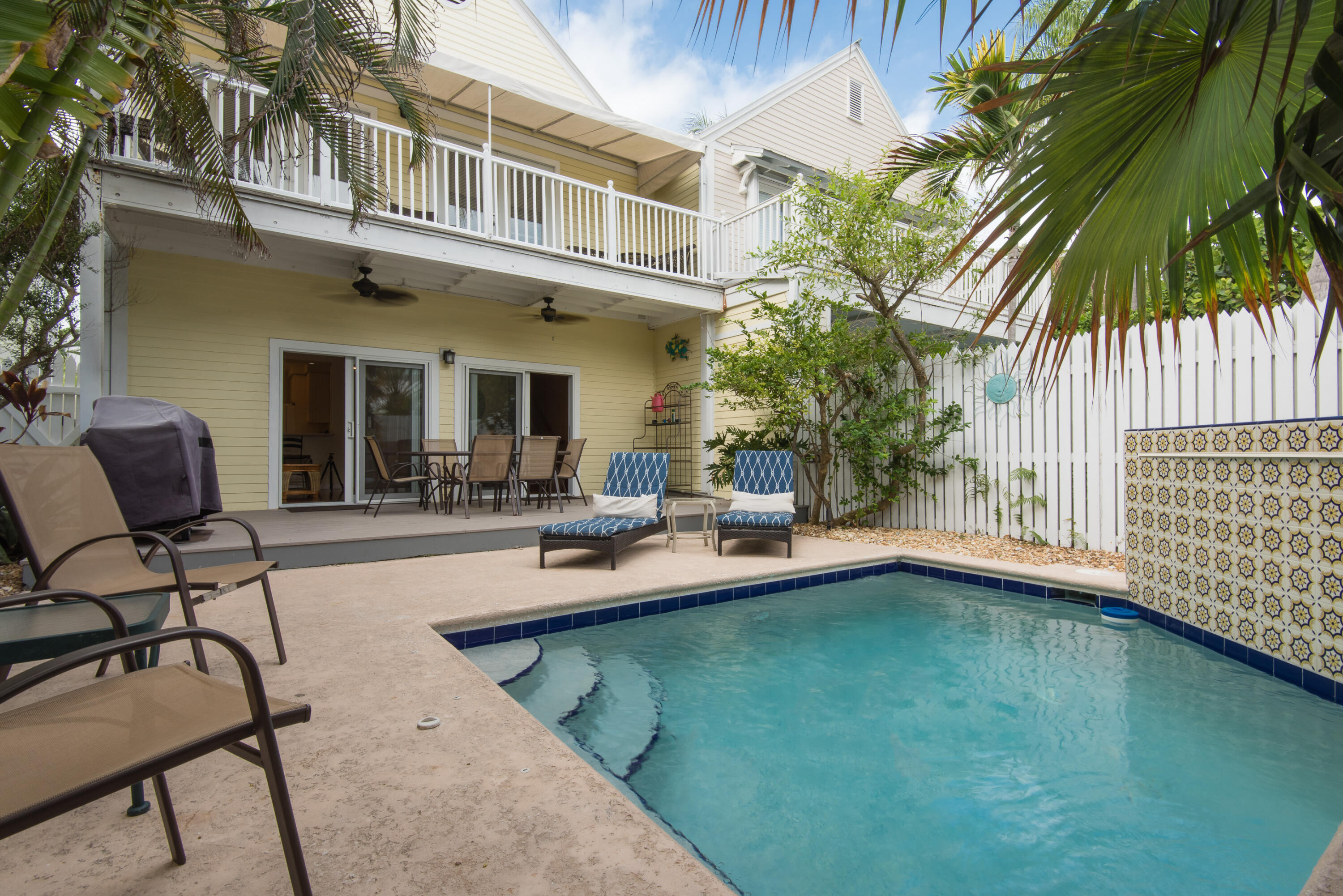 502 Porter Lane Key West, FL 33040 - Photo 20 of 38 a view of a house with swimming pool patio and swimming pool