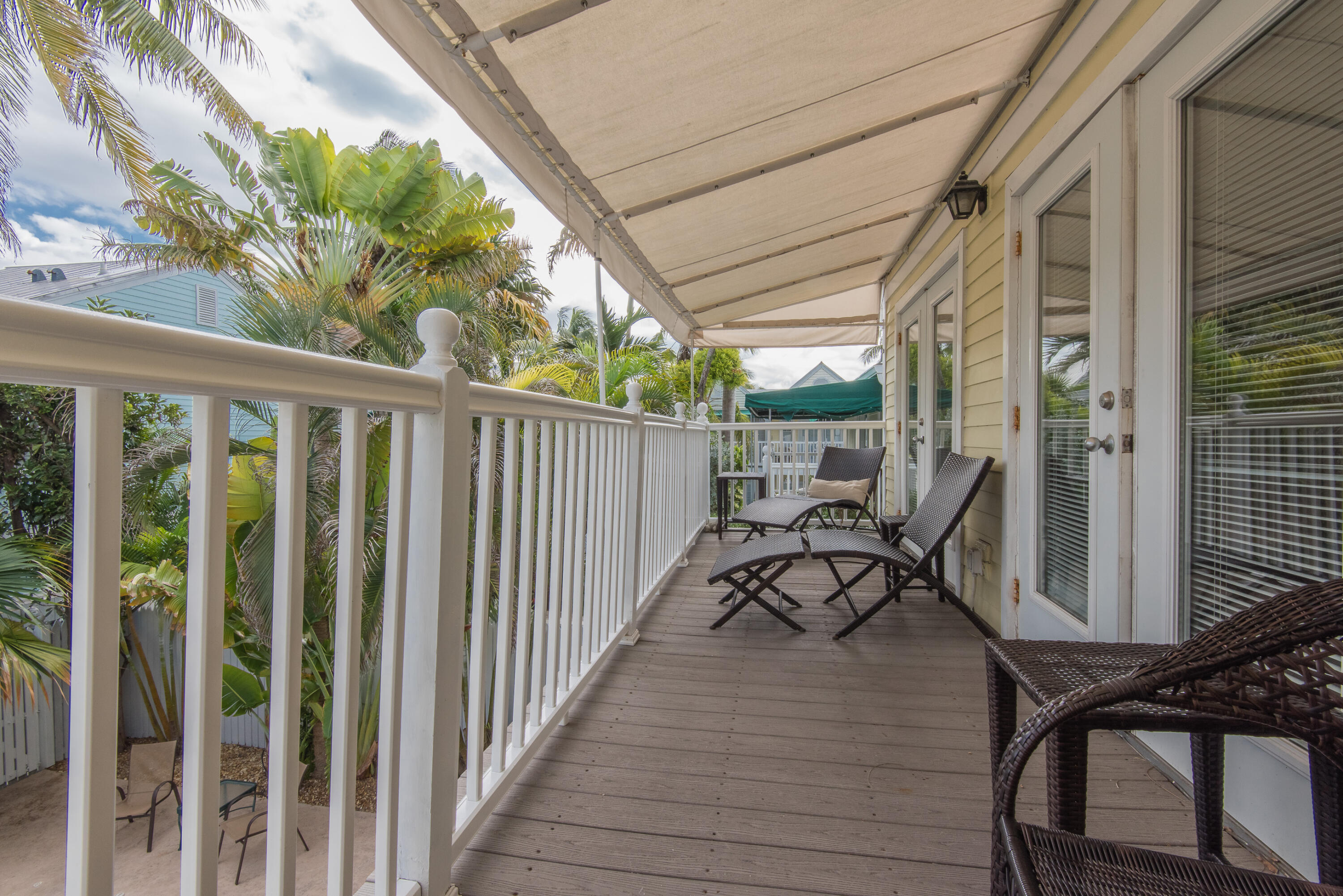 502 Porter Lane Key West, FL 33040 - Photo 23 of 38 a view of balcony with chairs and wooden fence