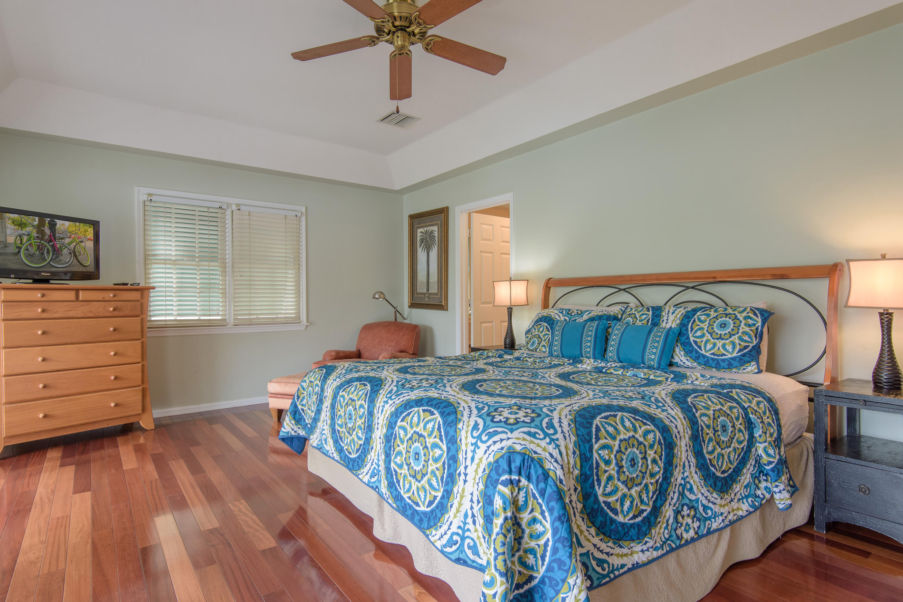502 Porter Lane Key West, FL 33040 - Photo 26 of 38 a bedroom with a bed and wooden floor