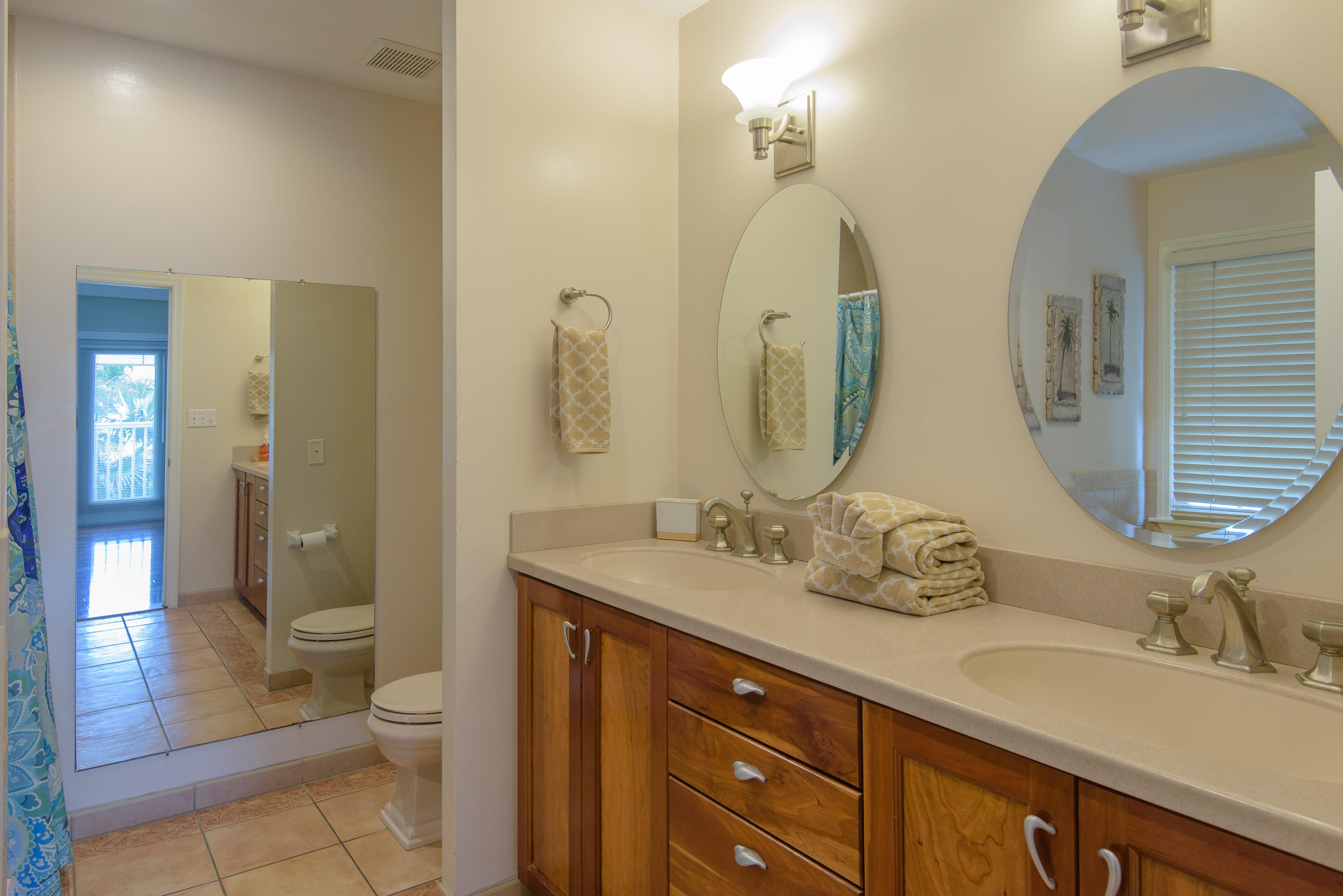502 Porter Lane Key West, FL 33040 - Photo 28 of 38 a bathroom with a double vanity sink toilet and shower