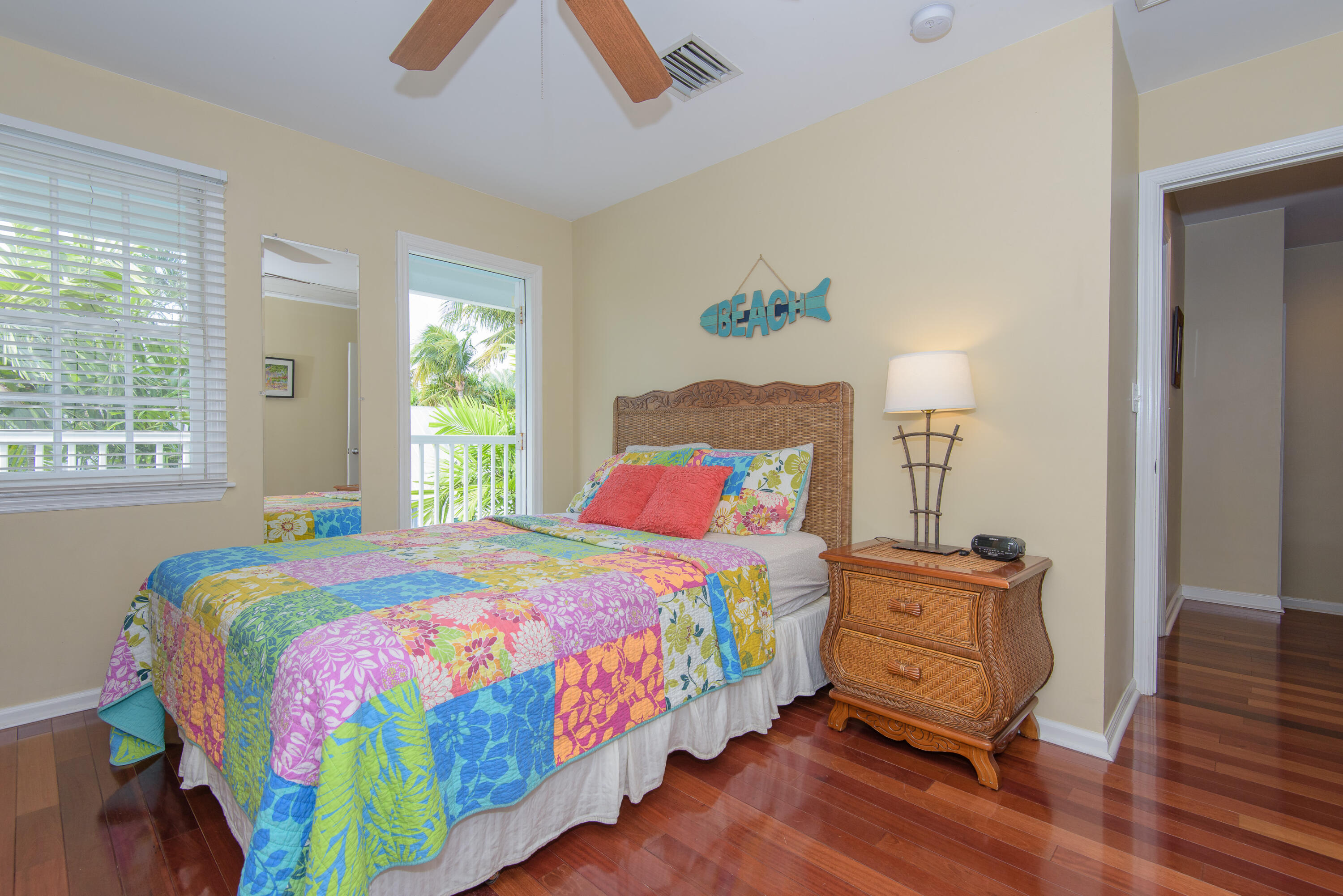502 Porter Lane Key West, FL 33040 - Photo 33 of 38 a bedroom with a bed and wooden floor