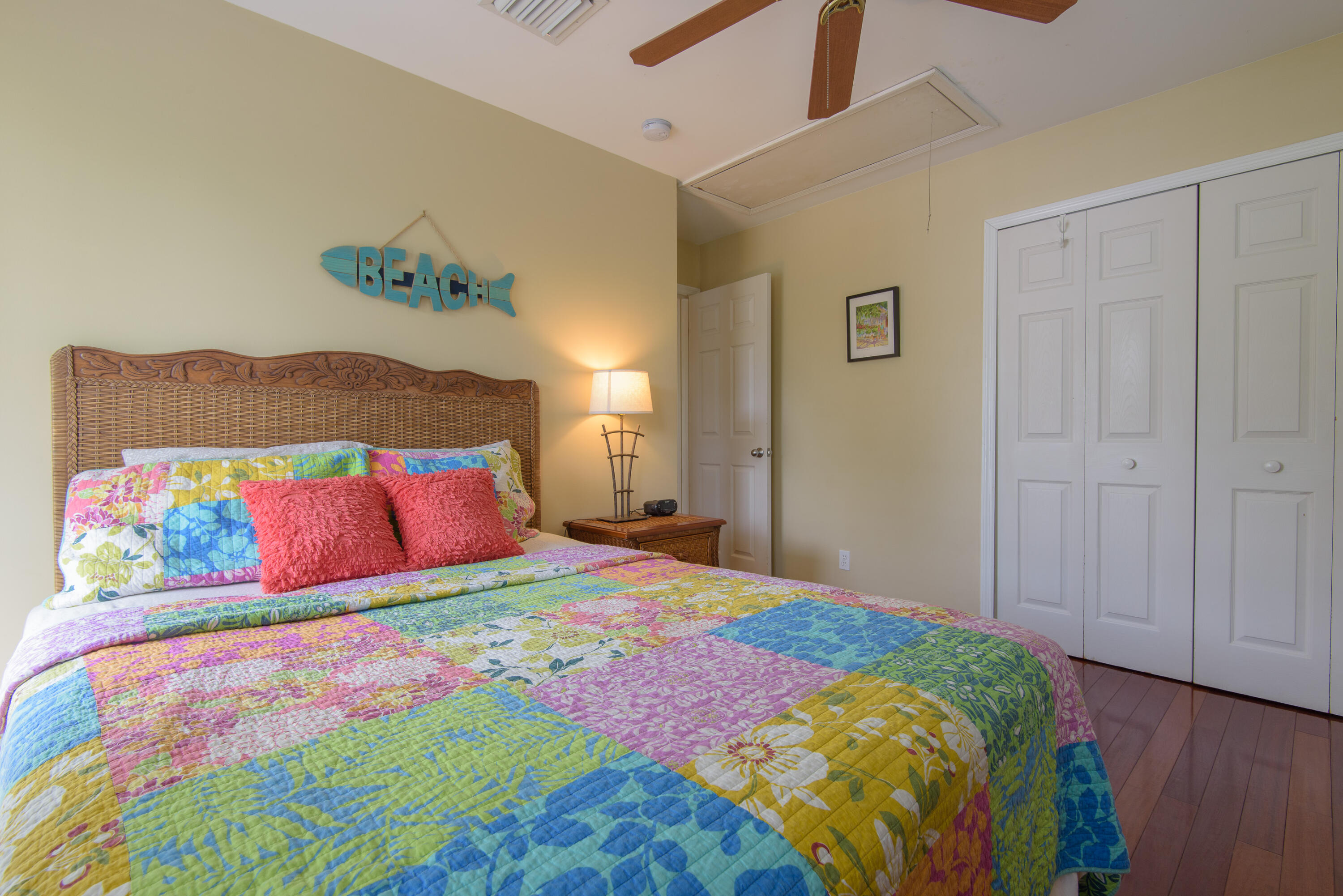 502 Porter Lane Key West, FL 33040 - Photo 36 of 38 a bedroom with a bed and wooden floor