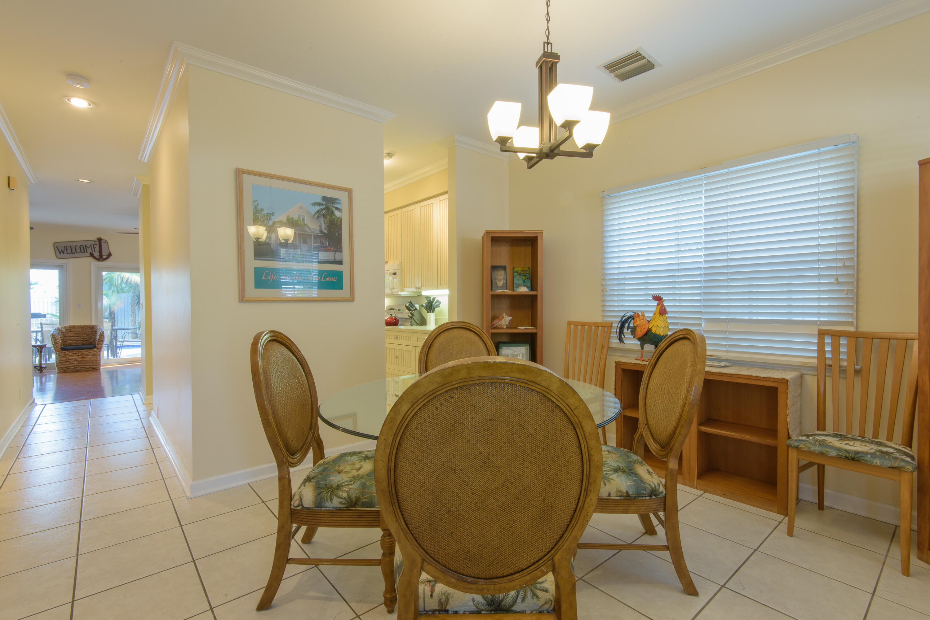 502 Porter Lane Key West, FL 33040 - Photo 4 of 38 a view of a dining room with furniture and chandelier