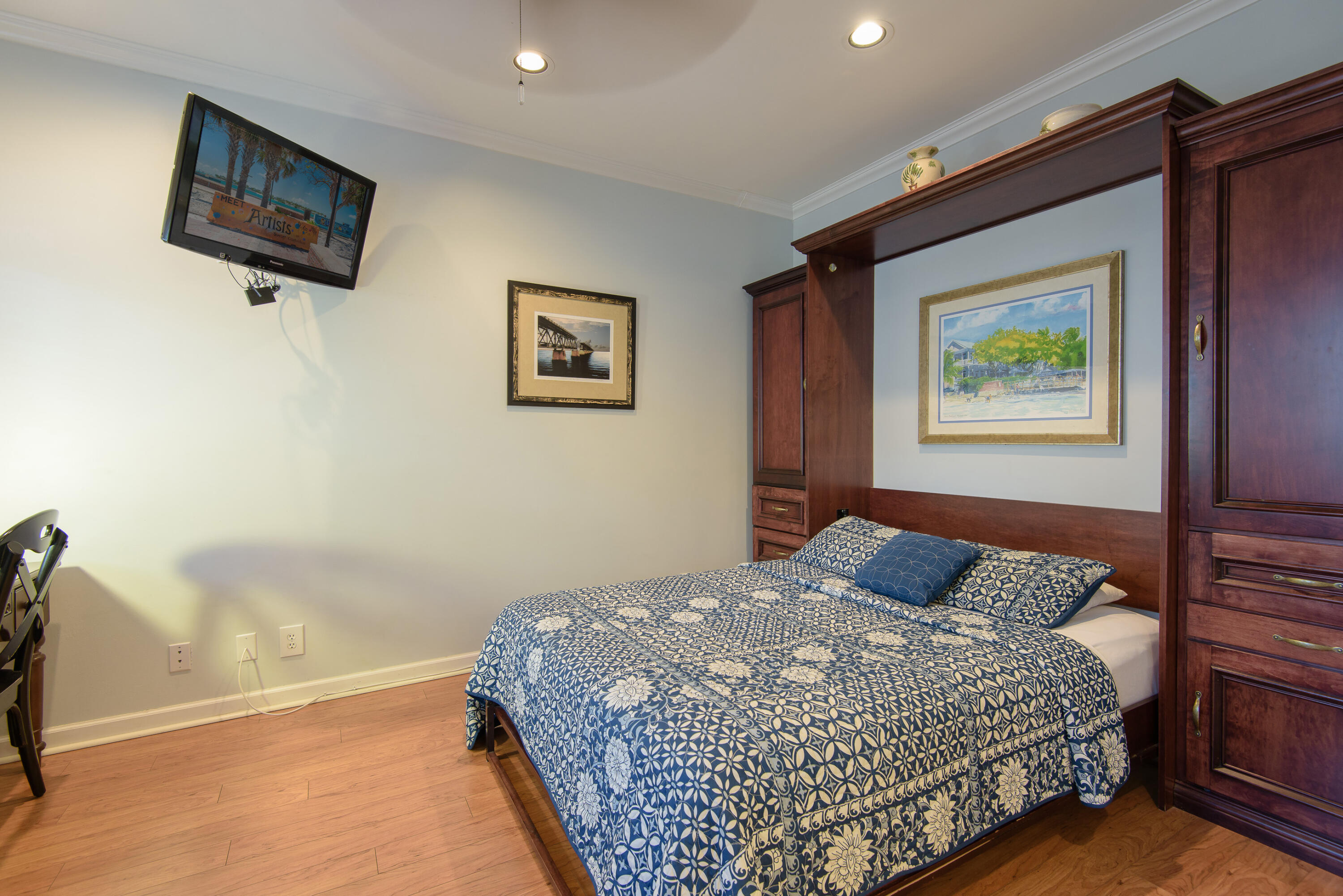 502 Porter Lane Key West, FL 33040 - Photo 7 of 38 a bedroom with a bed and a painting on the wall