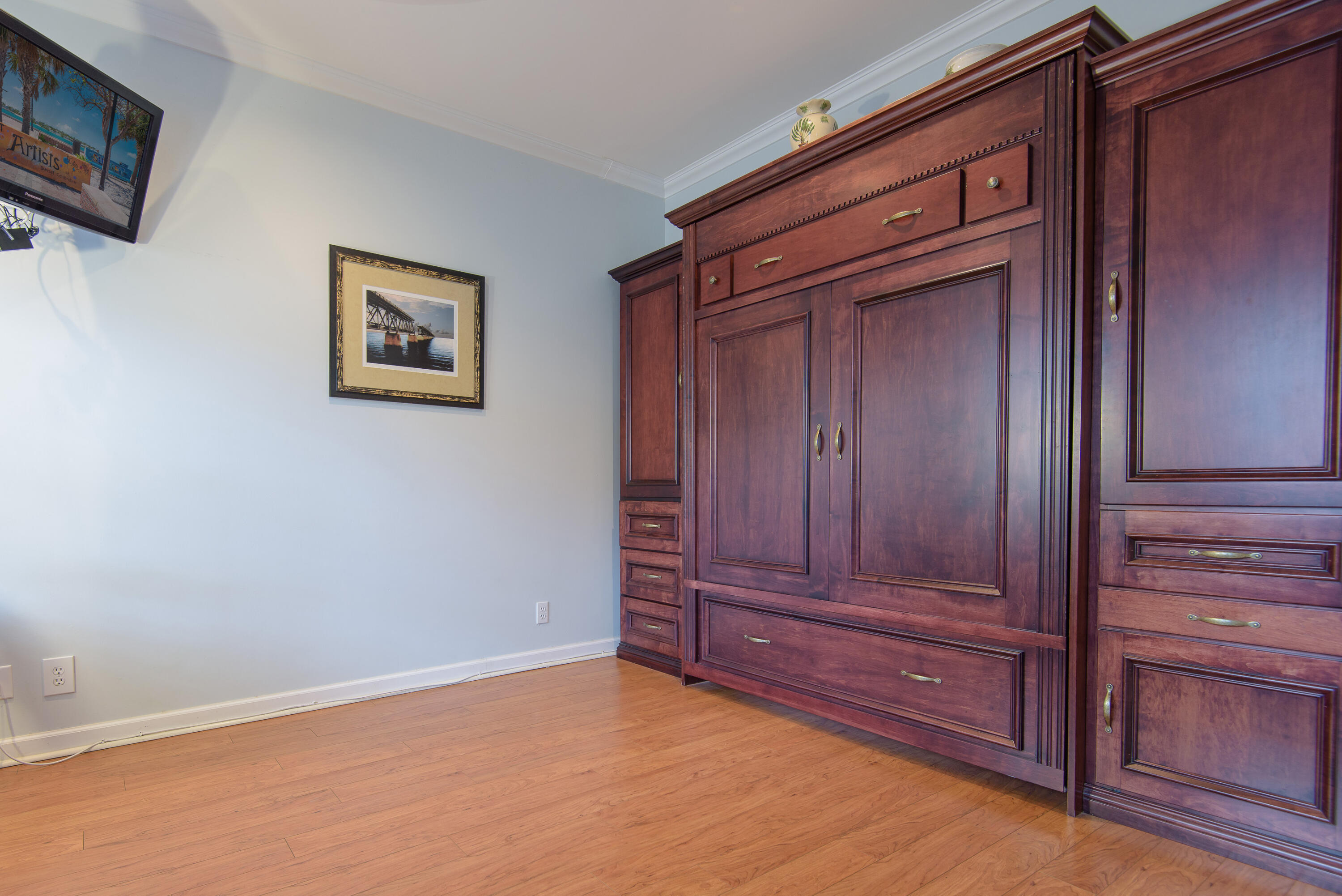 502 Porter Lane Key West, FL 33040 - Photo 8 of 38 an empty room with wooden floor and closet