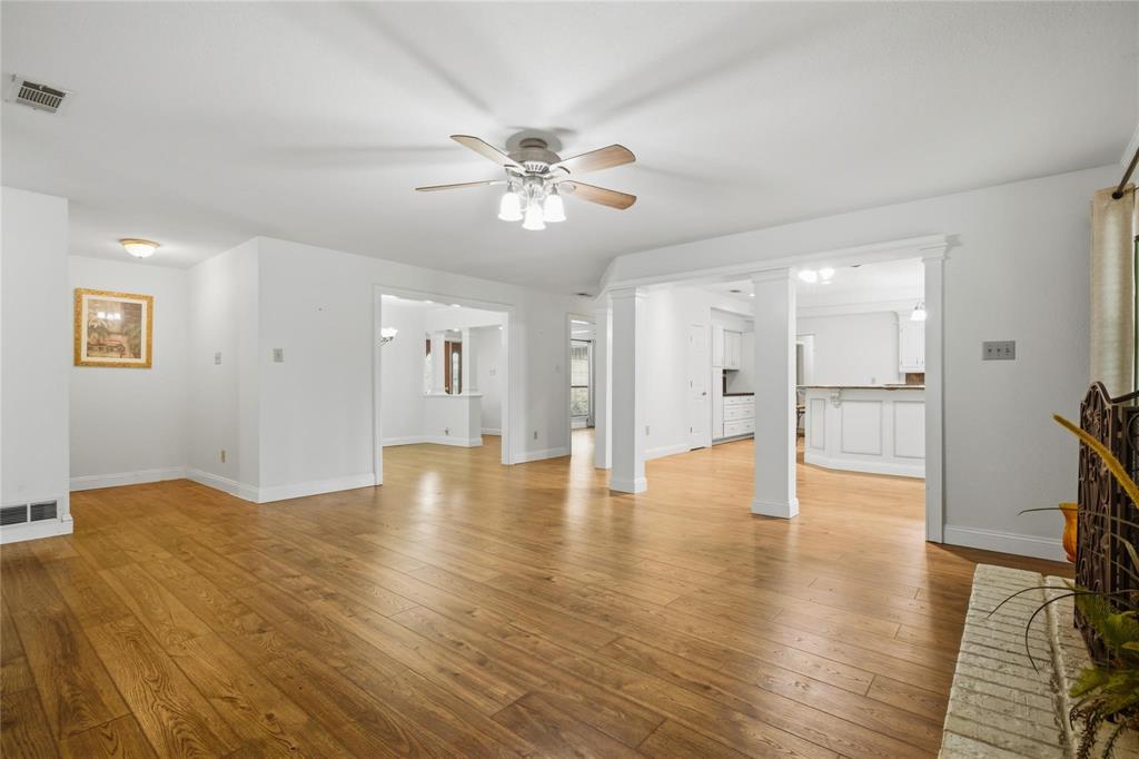 265 East Dove Road Southlake, TX 76092 - Photo 9 of 39 a view of an empty room with wooden floor and a window