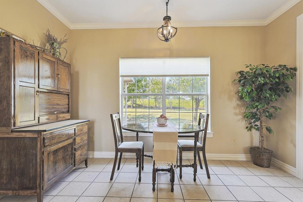 3289 Mitchell Road Krum, TX 76249 - Photo 12 of 40 a dining room with furniture and window