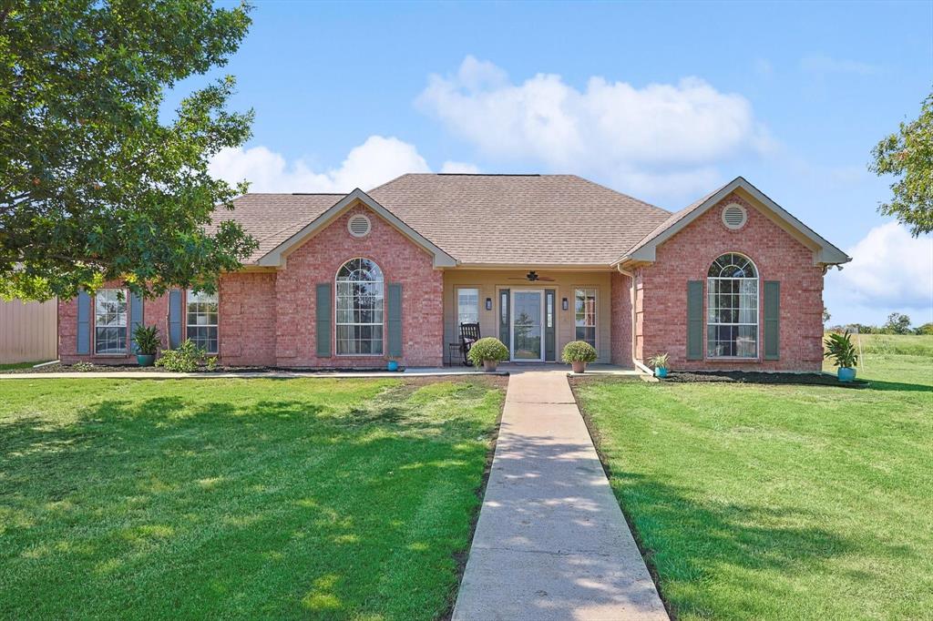 3289 Mitchell Road Krum, TX 76249 - Photo 3 of 40 a front view of a house with yard