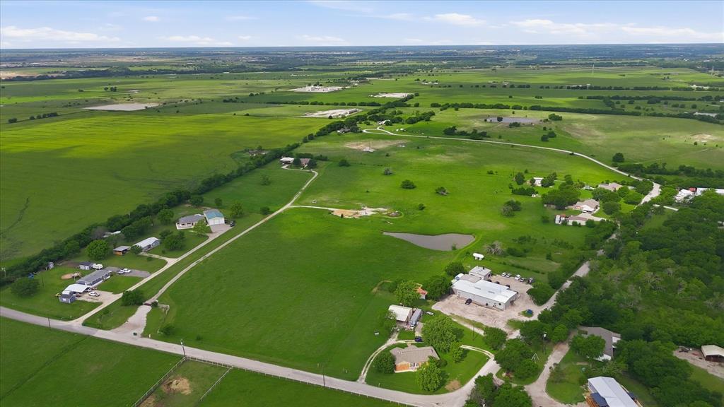 3289 Mitchell Road Krum, TX 76249 - Photo 32 of 40 a view of a golf course with a lake