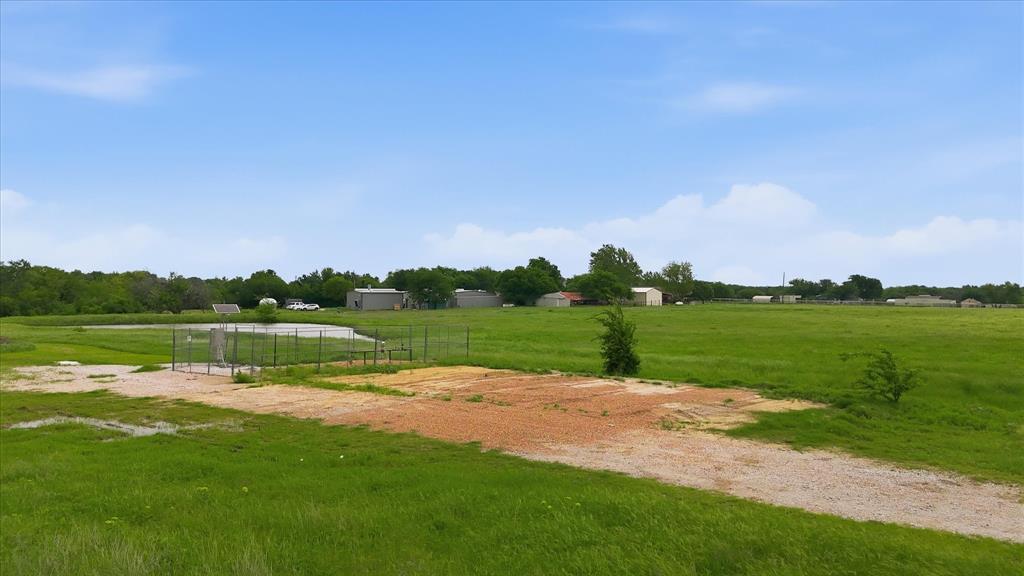 3289 Mitchell Road Krum, TX 76249 - Photo 34 of 40 a view of a lake with a big yard