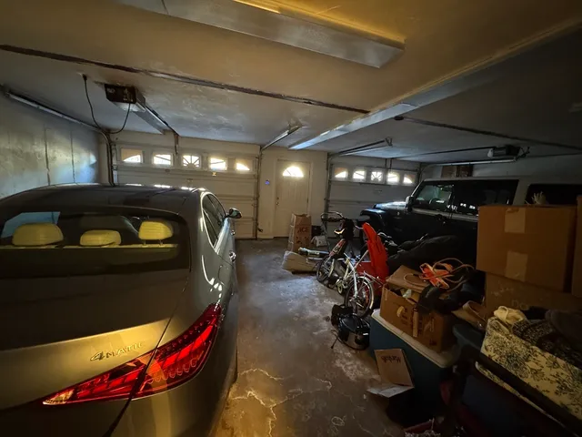 a bedroom with a bed a dresser and a book shelf
