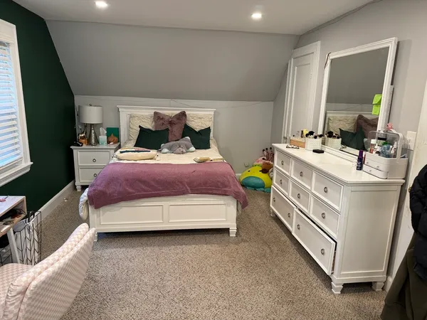 a room with furniture and a flat screen tv