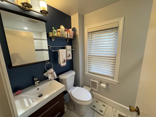 a bathroom with a shower and toilet