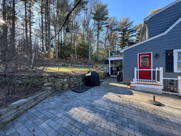 a view of a house with a large tree