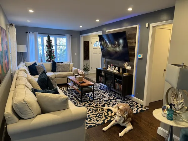 a living room with furniture and a flat screen tv