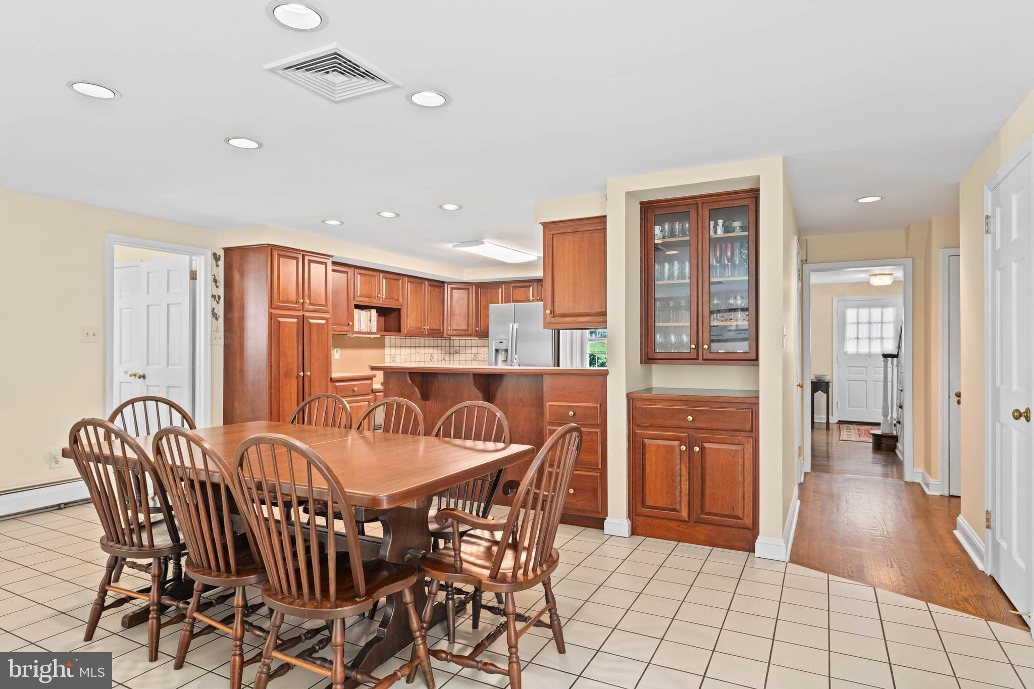 912 Centennial Road Penn Valley, PA 19072 - Photo 14 of 54 a dining area with stainless steel appliances a dining table and chairs