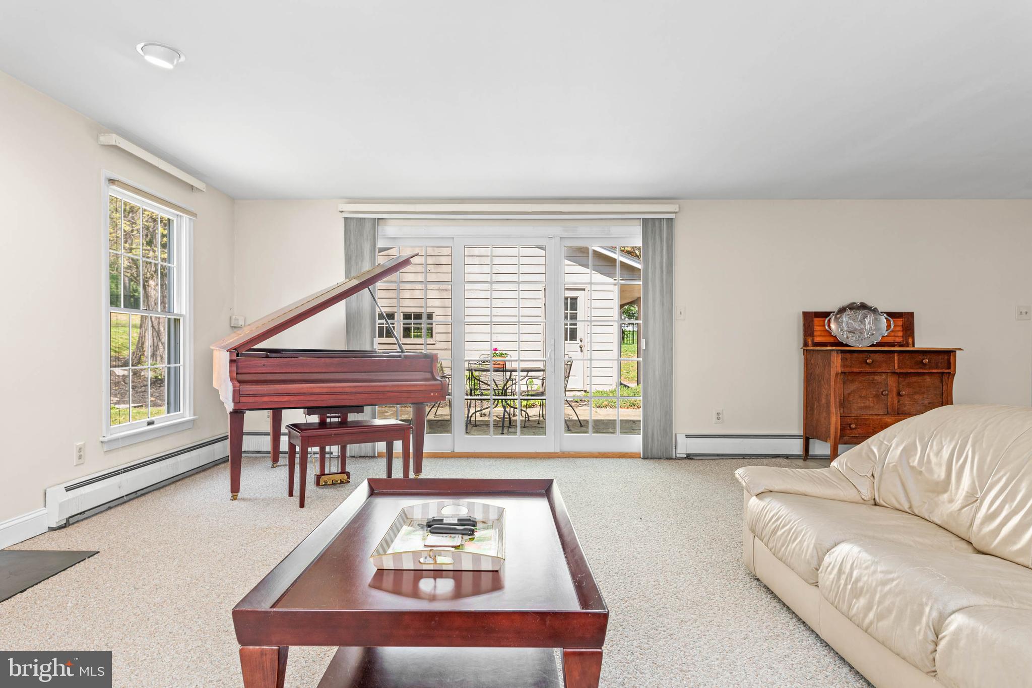 912 Centennial Road Penn Valley, PA 19072 - Photo 18 of 54 a living room with furniture a large window and a table