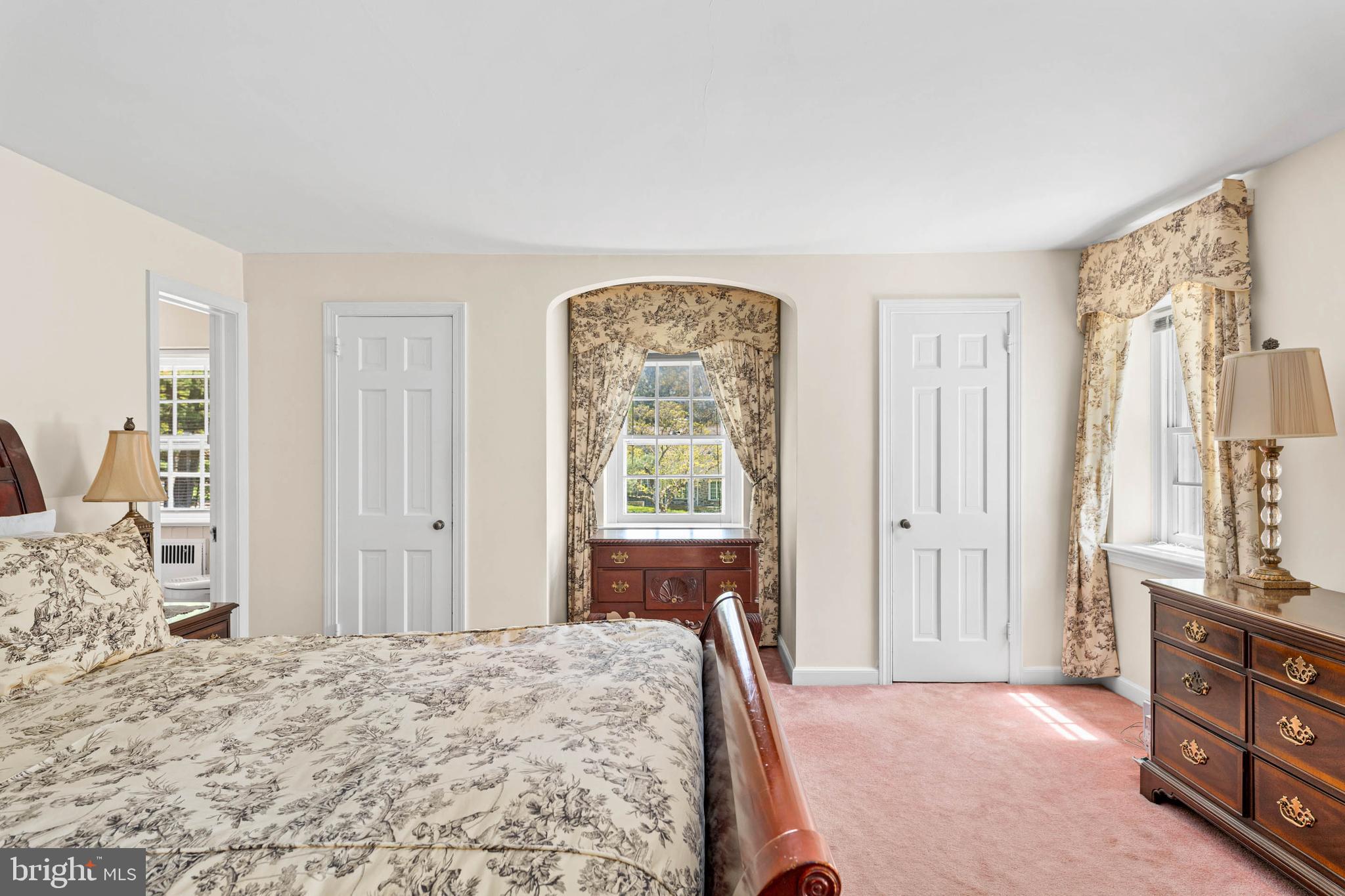 912 Centennial Road Penn Valley, PA 19072 - Photo 24 of 54 a bedroom with a bed and a dresser next to a window