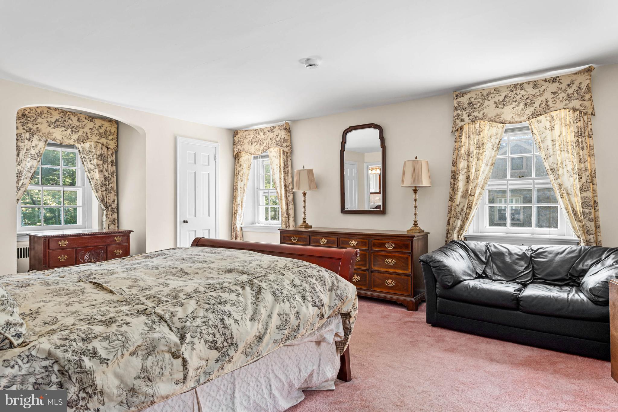 912 Centennial Road Penn Valley, PA 19072 - Photo 25 of 54 a bedroom with a bed couch and window