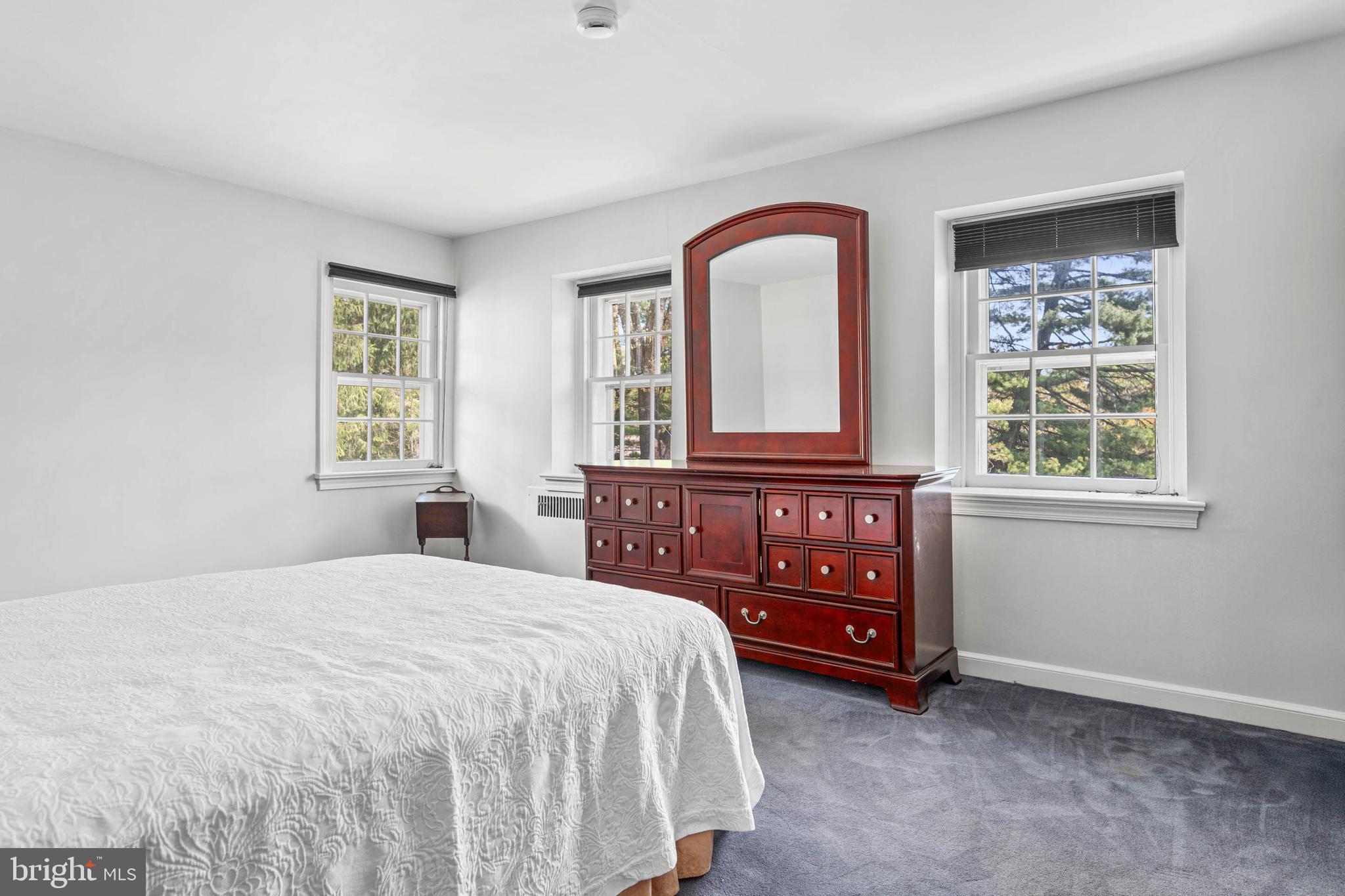 912 Centennial Road Penn Valley, PA 19072 - Photo 29 of 54 a bedroom with a bed and a dresser