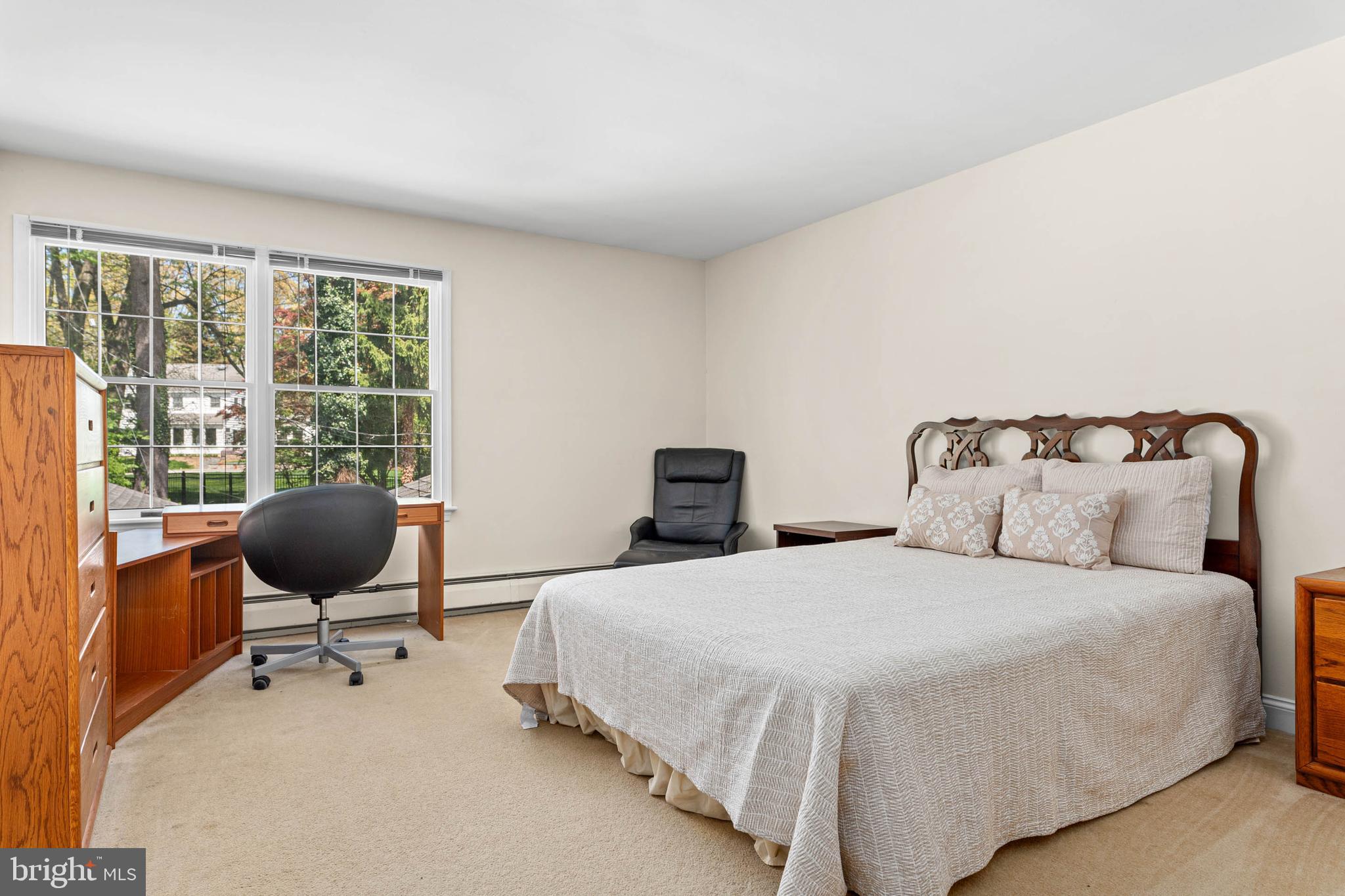 912 Centennial Road Penn Valley, PA 19072 - Photo 35 of 54 a bedroom with a bed a desk and chair