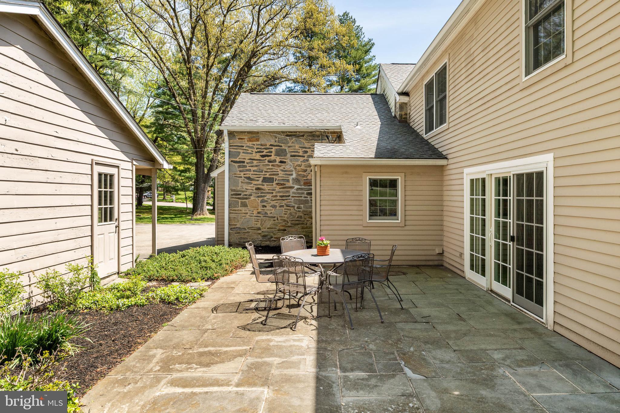 912 Centennial Road Penn Valley, PA 19072 - Photo 46 of 54 a backyard of a house with outdoor seating